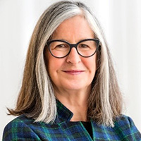 Headshot of Ann Chester, smiling.