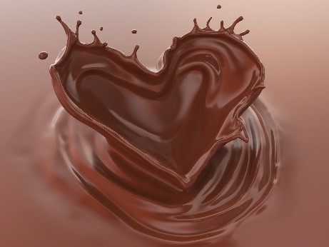 Liquid chocolate forming a heart shape.