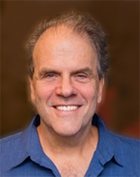 A headshot of Dr. Joseph Carcillo in a button-down shirt.