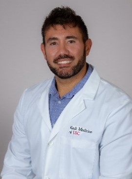 A profile picture of Dr. Lozito wearing a white lab coat.