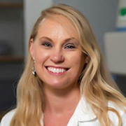 A headshot of Dr. Bohannon wearing a lab coat.