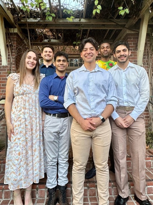 Dr. Picazo standing with five other people posing for a picture.