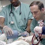 Doctors helping a patient. Credit: U.S. Navy.
